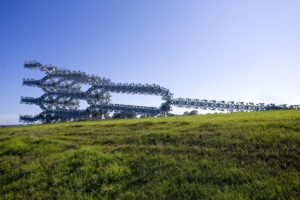 Simeon Nelson. Desiring Machine, 2008. laser-cut 16- 24mm galvanized steel plate, sections welded and bolted together 38 x 10 x 10 m. Image courtesy the artist.