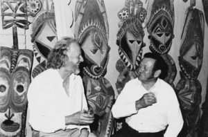 Tony Tuckson former Deputy Director AGNSW and Stan Moriarty with carved figures from Abelam haus tamberan Sydney 1960s Photo Margaret Tuckson. Courtesy AGNSWArchives
