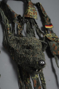 Fiona Hall Mustela lutreola / European mink, Europe, 2012 IUCN threat status: vulnerable German military shirt (’flecktarn’ camouflage pattern), teeth, mink paws, bottle cap (Detail). Courtesy of the artist and Roslyn Oxley Gallery, © the artist