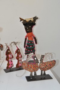 Yarrenyty Arltere Artists, Dulcie Sharpe, Two red birds (right); Dulcie Sharpe, Two eagles; Trudy Inkamala, Little woman with coolamon (back). Image courtesy the artists and Aboriginal and Pacific Art Gallery